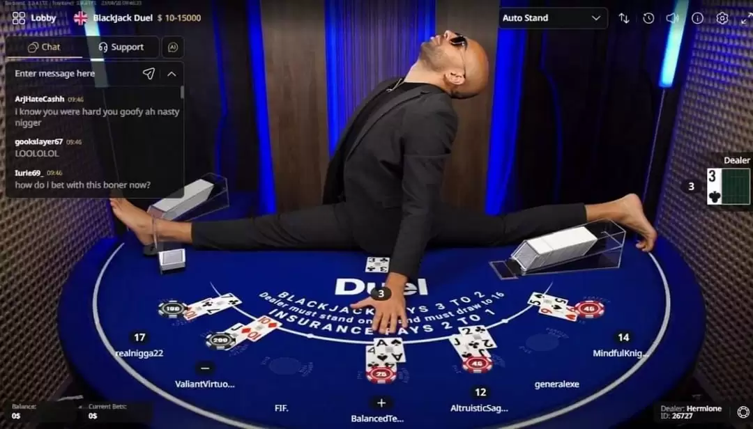 An online casino blackjack dealer dropped into a split right on top of the card table. Media 0